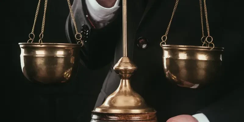 cropped-shot-of-lawyer-holding-justice-scales-isol-2024-11-17-10-02-00-utc.webp